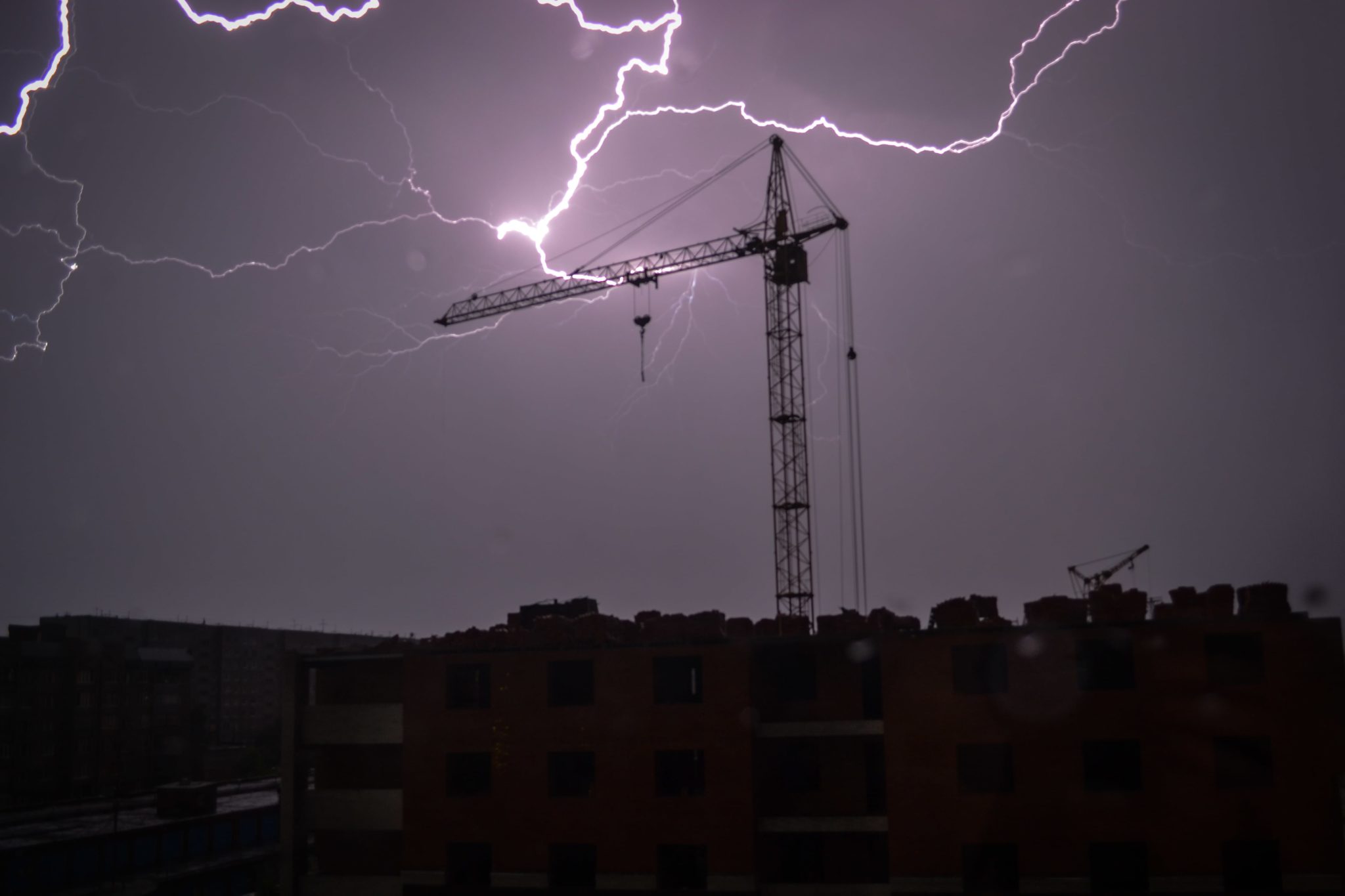 business interruption insurance can help mitigate disaster, lightening strikes construction crane