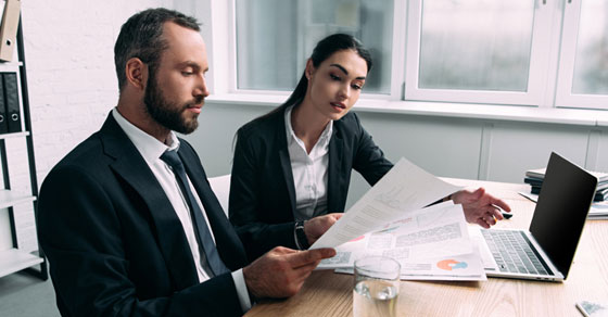 employees looking at documents