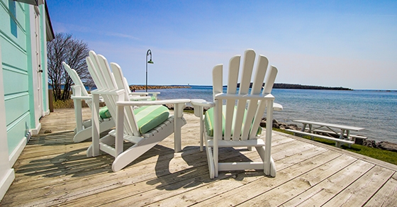 chairs on a deck by the beach