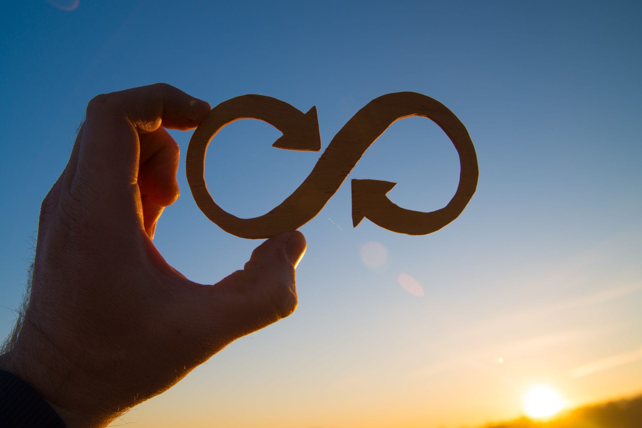 man holding loop shaped board