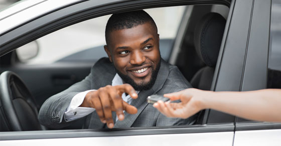 man in his car smiling