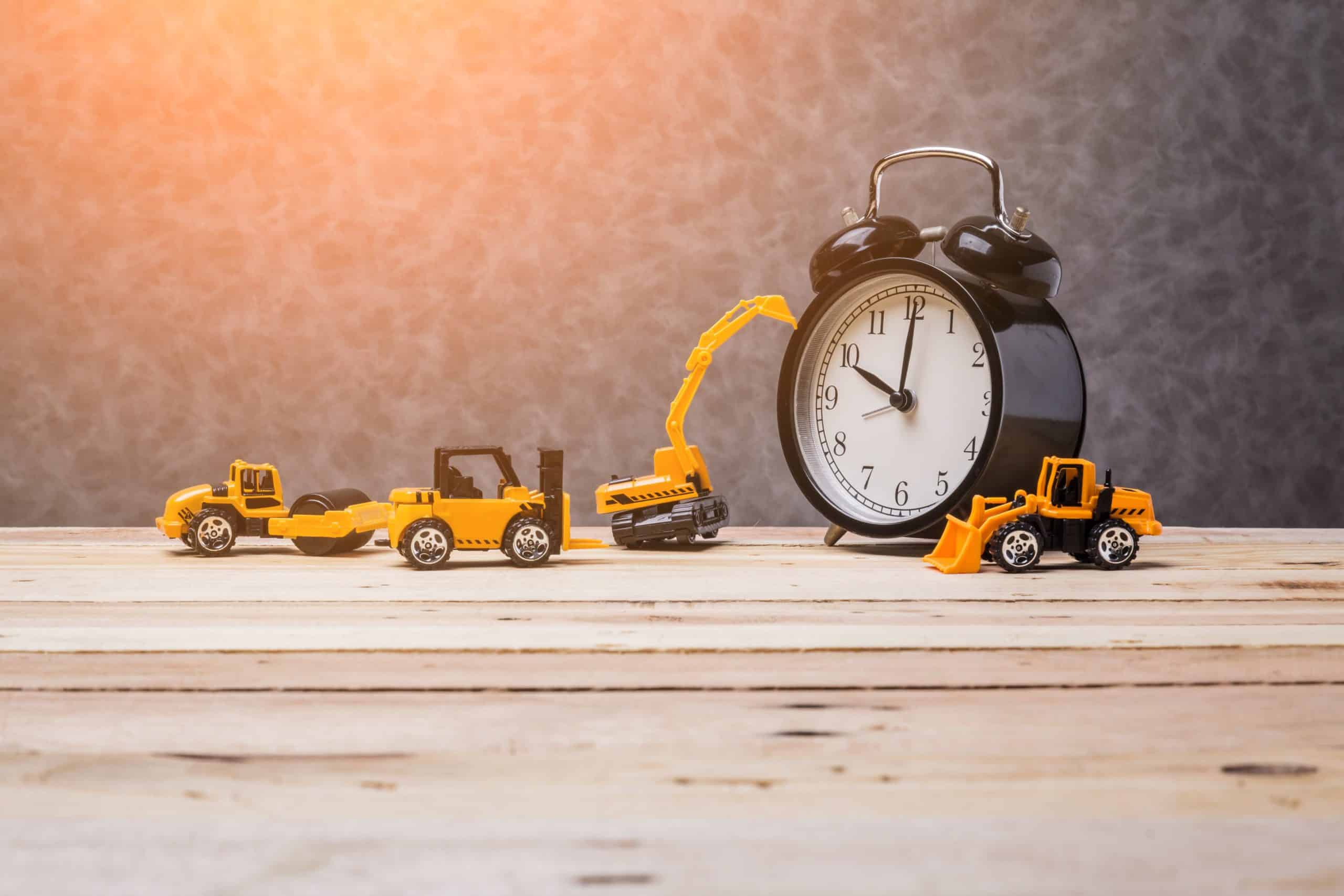 clock and construction vehicles