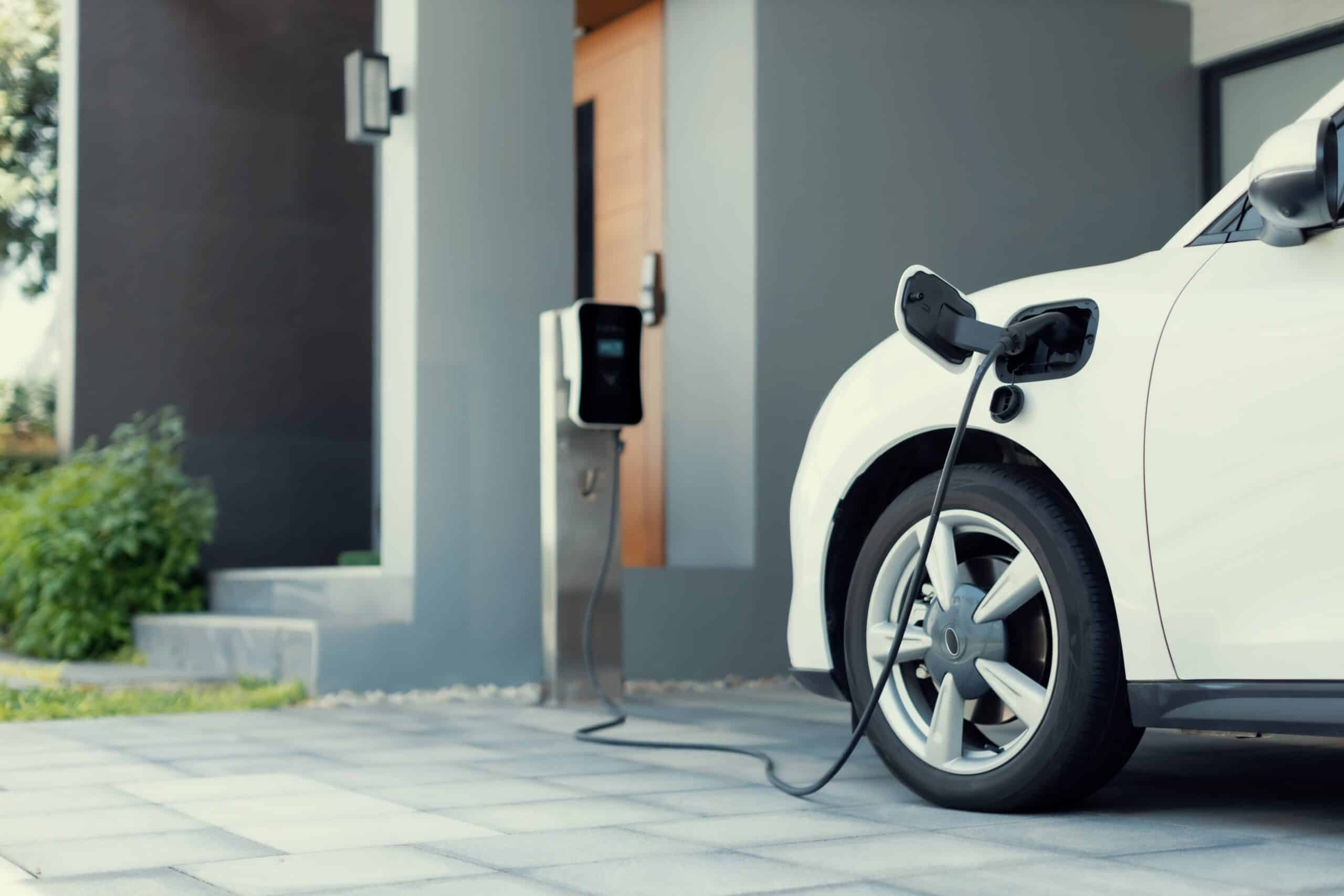 Electric car plugged in to charger