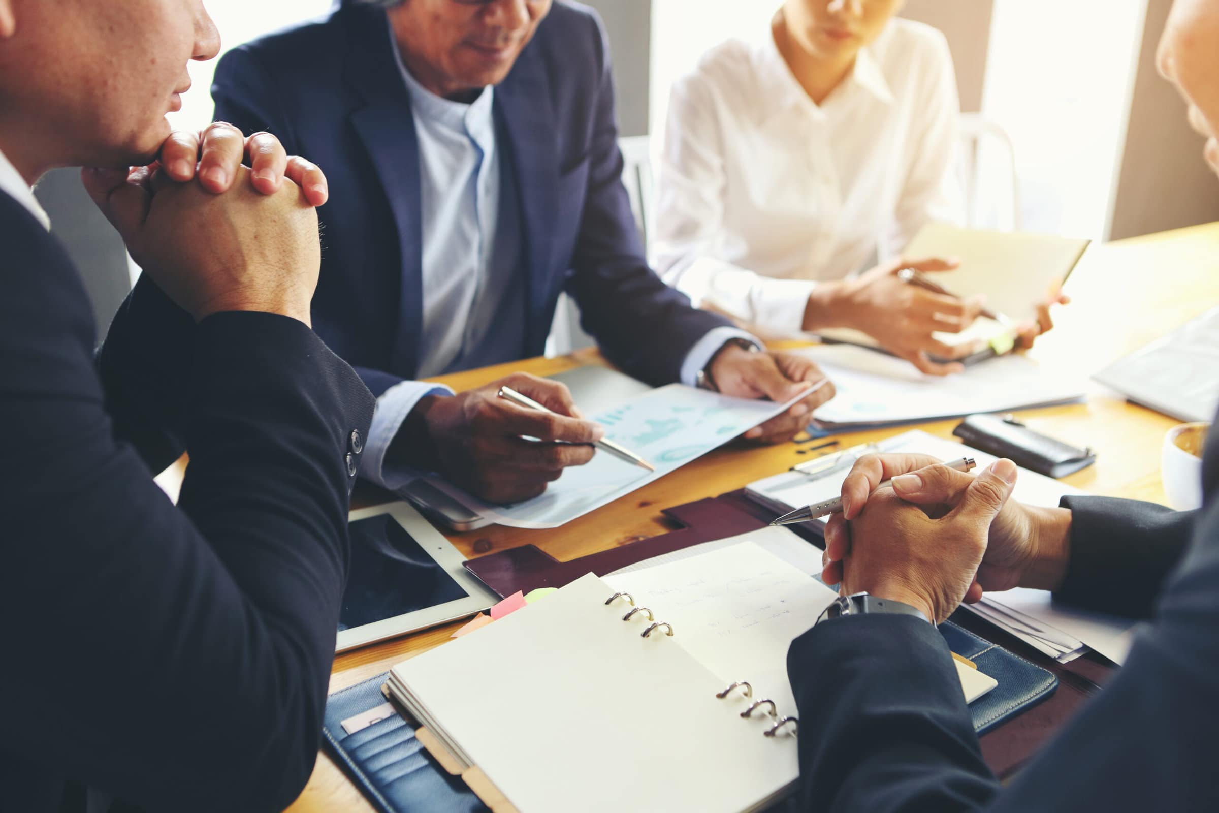 a group of business people meeting for a marketing plan