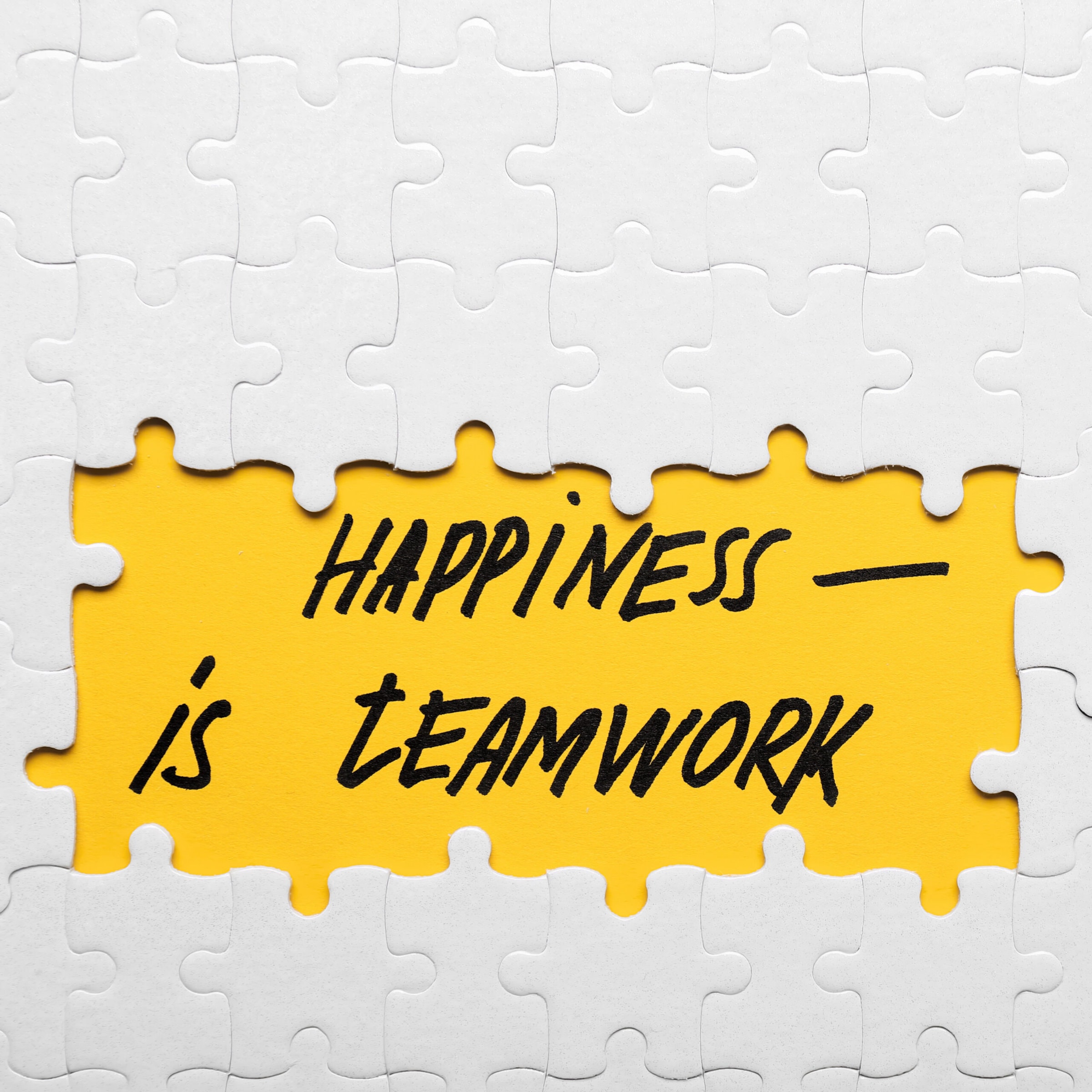 Happiness is Team work puzzle concept