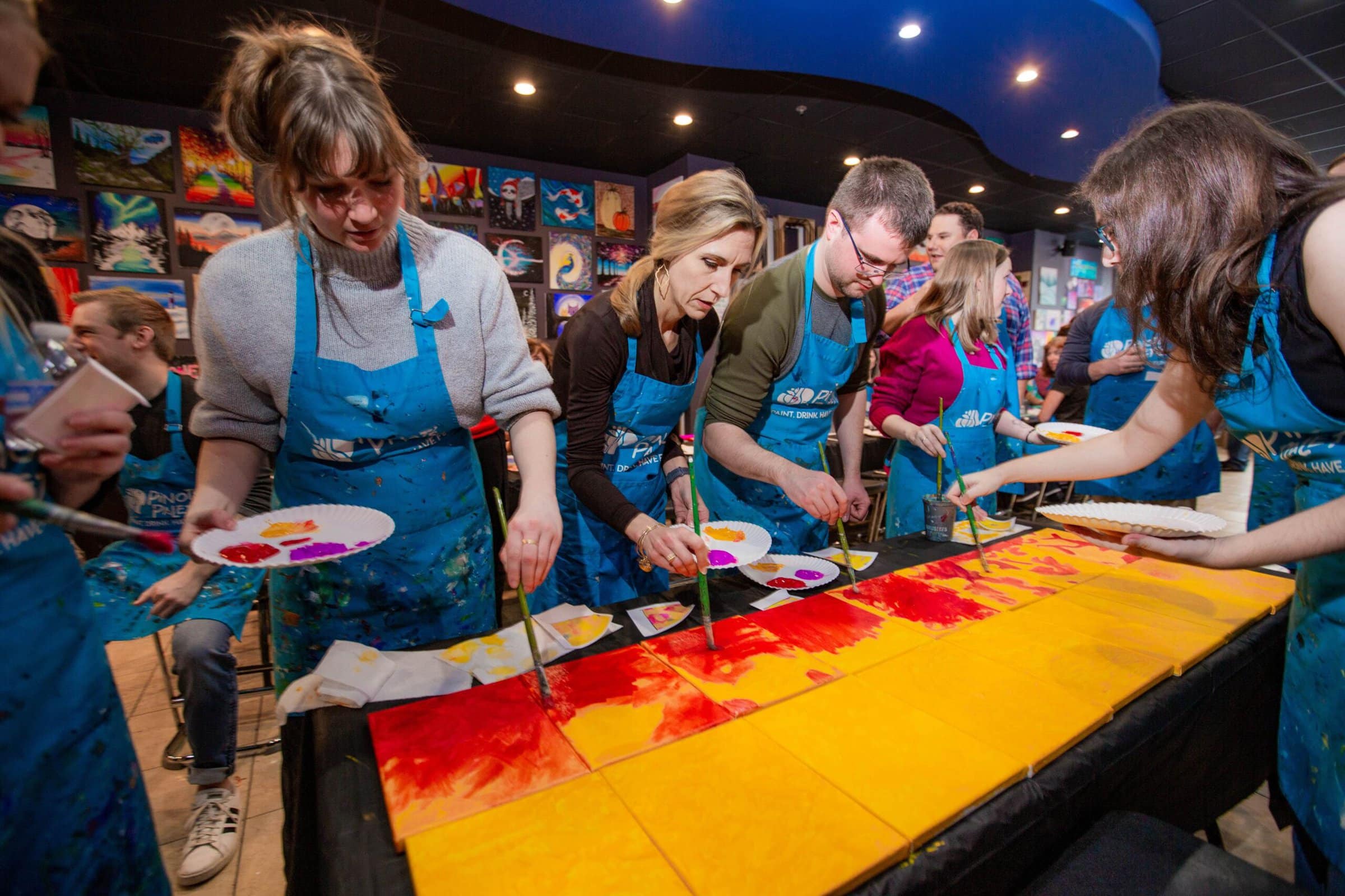 Coworkers painting together