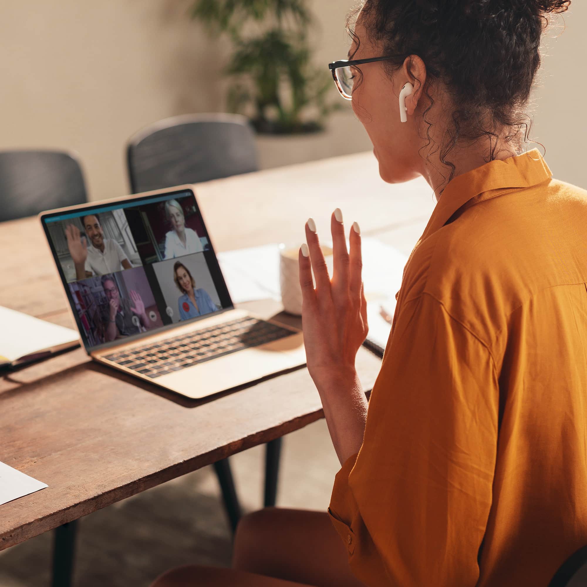 Woman in webinar woman having a zoom meeting with her coworkers