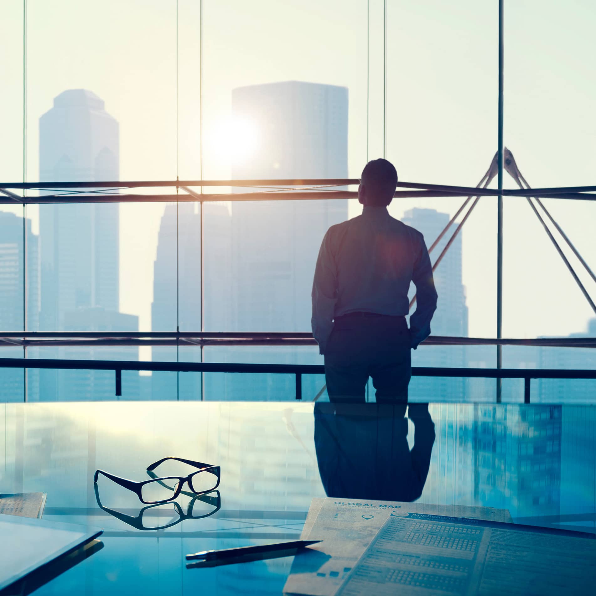 businessman looking outside the office window