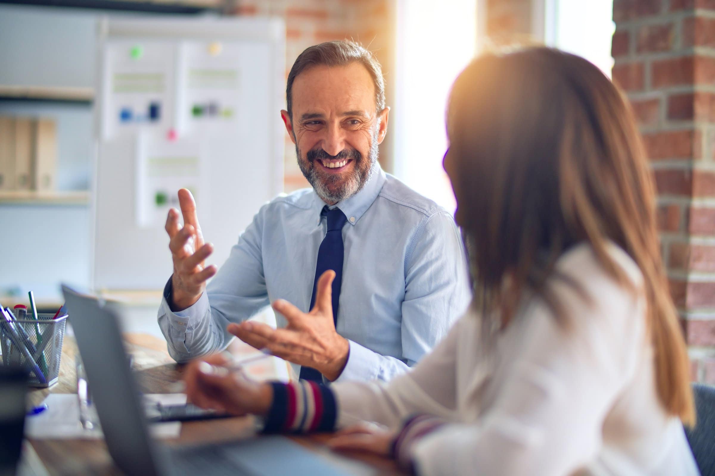 happy businessman talking to client