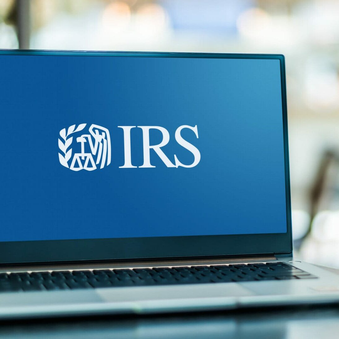 POZNAN, POL - JAN 6, 2021: Laptop computer displaying logo of The Internal Revenue Service (IRS), the revenue service of the United States federal government
