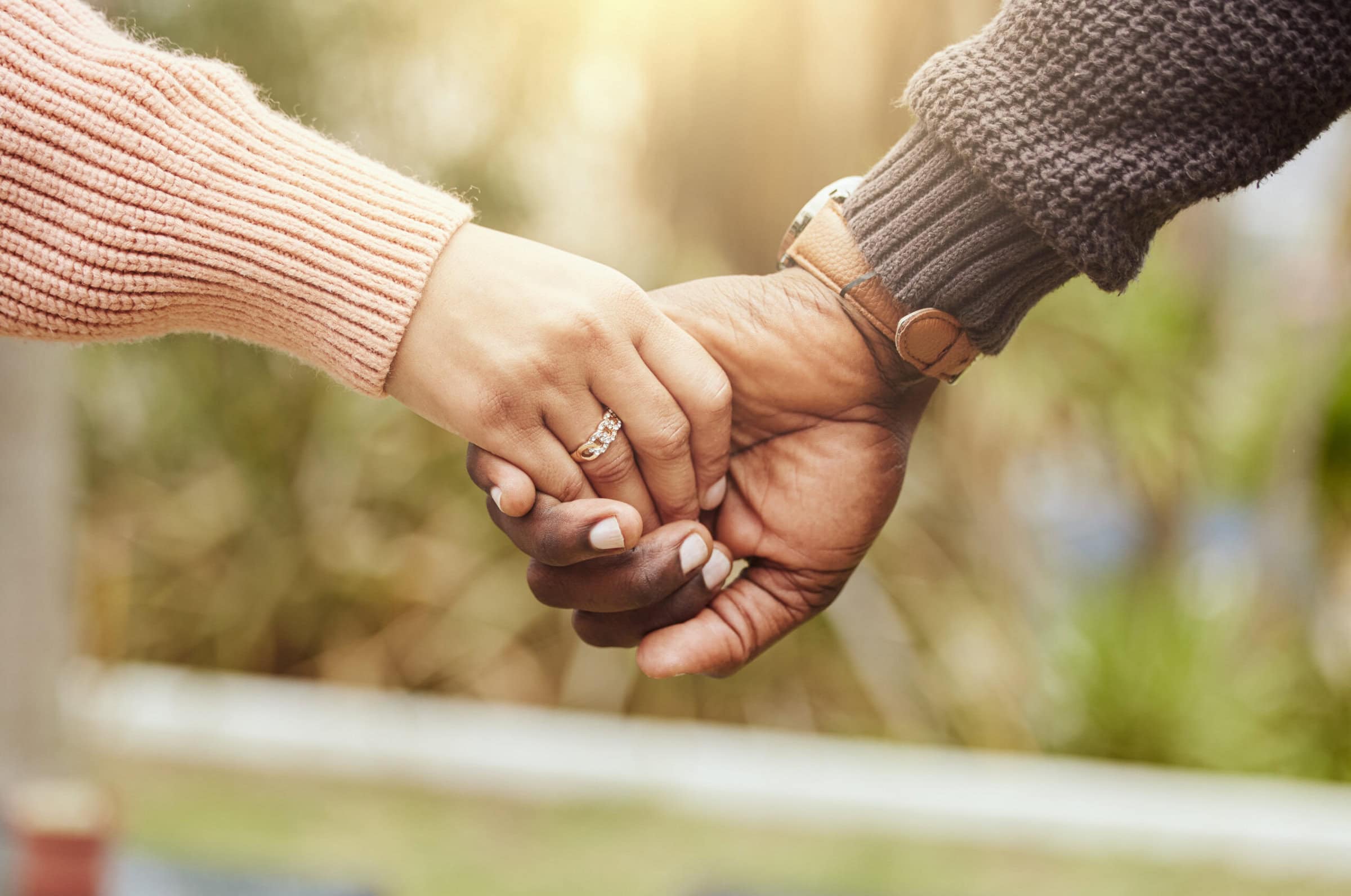 Love, support and trust hands of black couple in marriage together with care, romance and unity. Soulmate, married and man with woman holding hands for romantic bonding moment in nature zoom