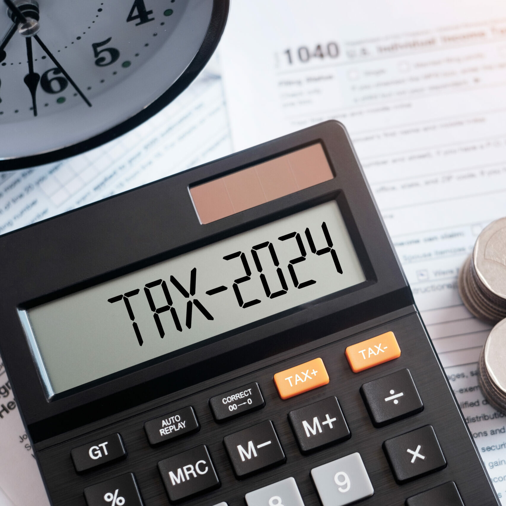 Word Tax 2024 on the calculator on documents.Income Statement. paying the tax rate. Taxation, taxes burden.Business and tax concept.