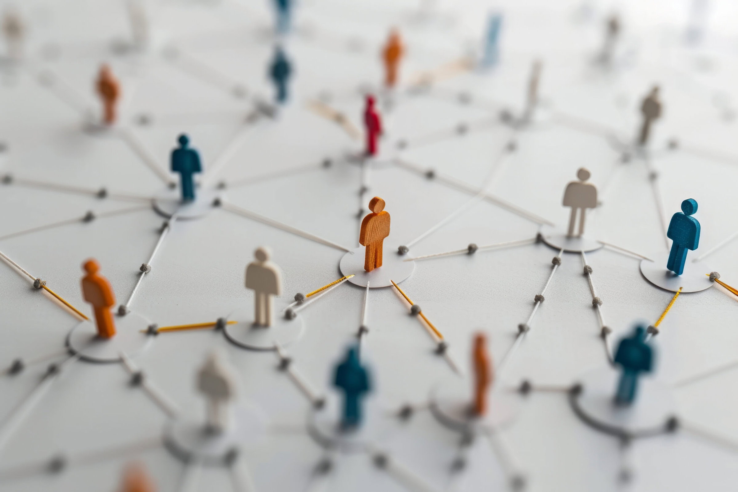 Large group of simple people shapes connected by lines.
