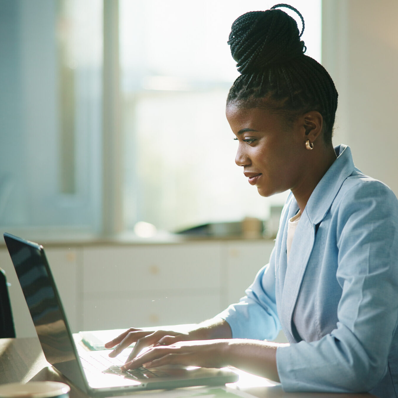 Business, laptop and black woman in office, typing and email for payroll schedule. African person, accountant and employee in workplace, pc or budget report with financial website or funding proposal.