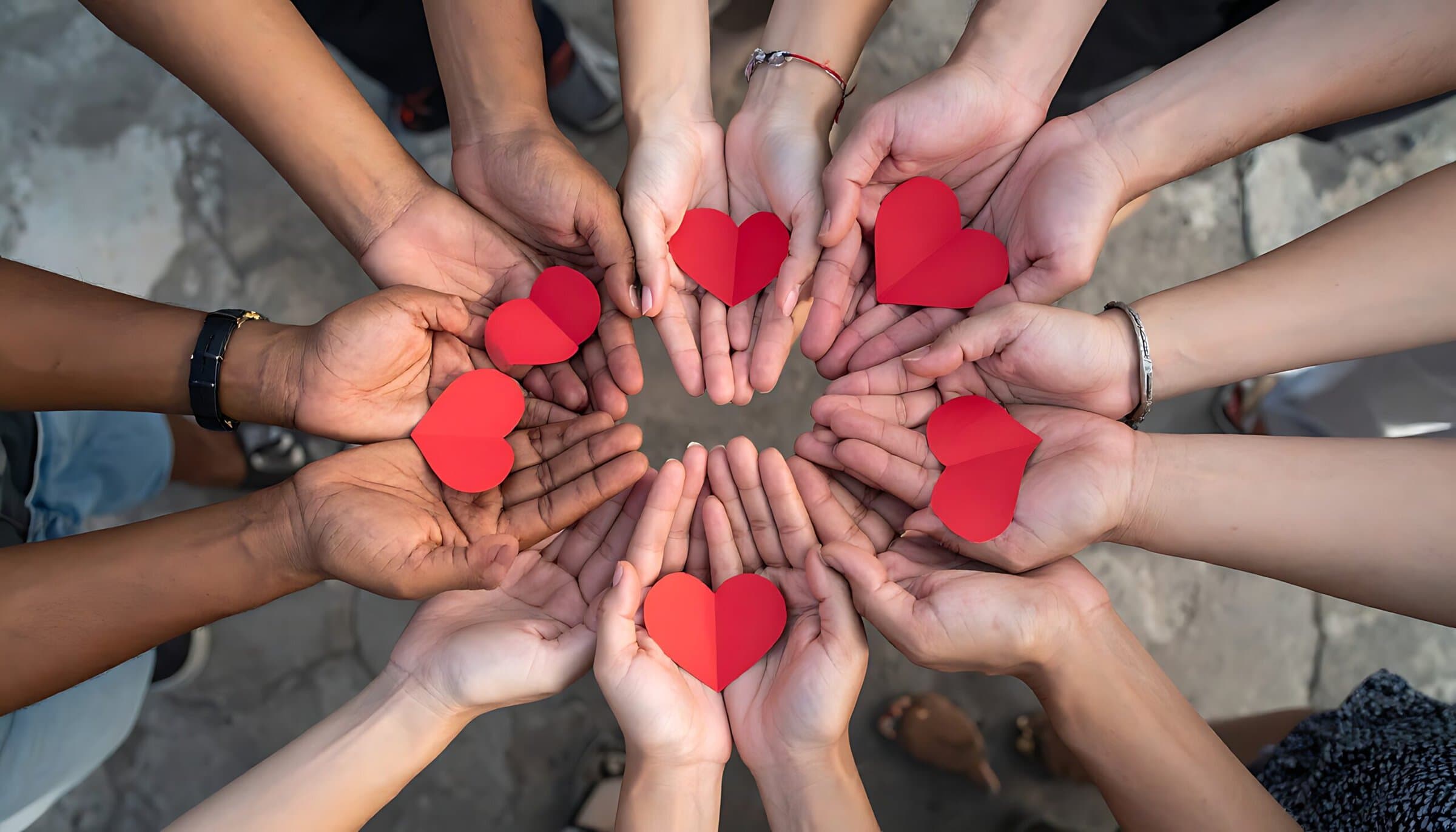 Hands sharing hearts